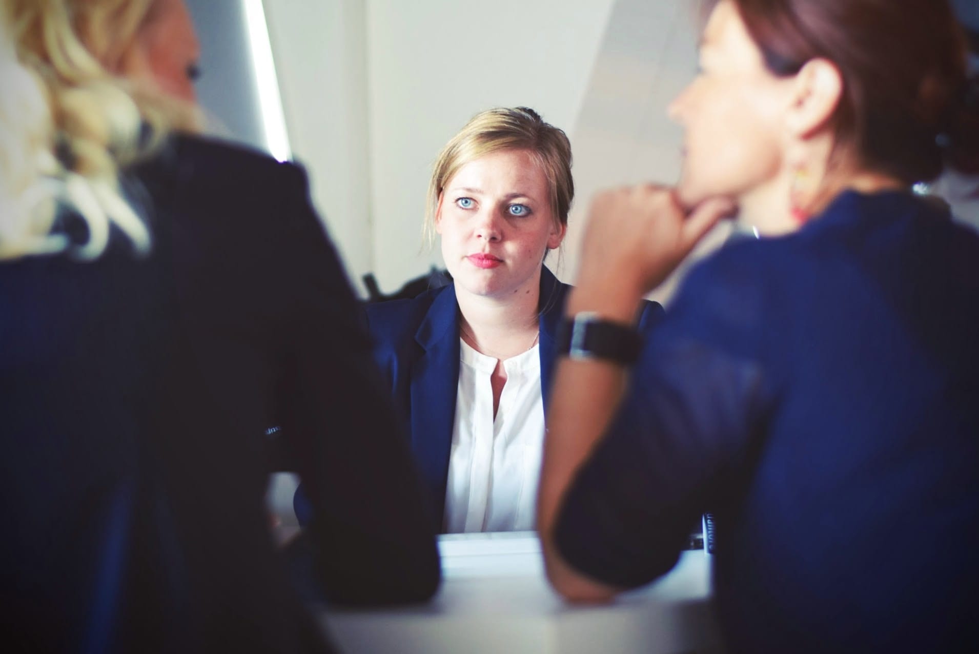 two women conducting an interview with an applicant