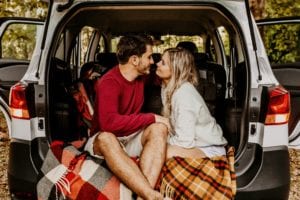 a couple dating in the back of an SUV, image related to the case study on market sizing