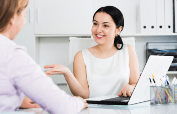Do consulting firms hire during an economic downturn? Image shows 2 business women in a meeting.