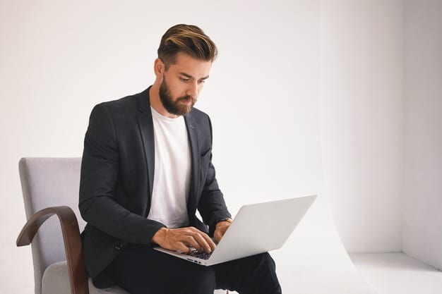 Guy researching how to answer the 'Why Accenture' question