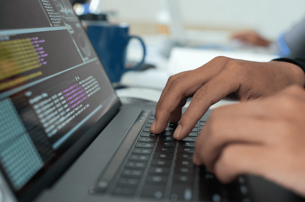 BCG Gamma Interview. This image shows someone working on a laptop.