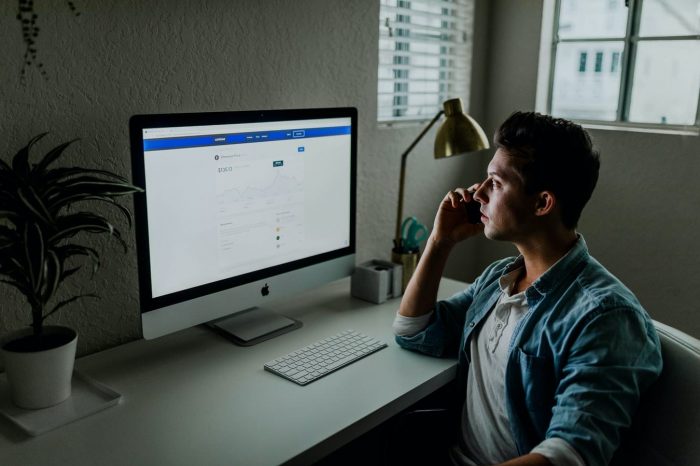 guy doing research on consulting networking on his computer.